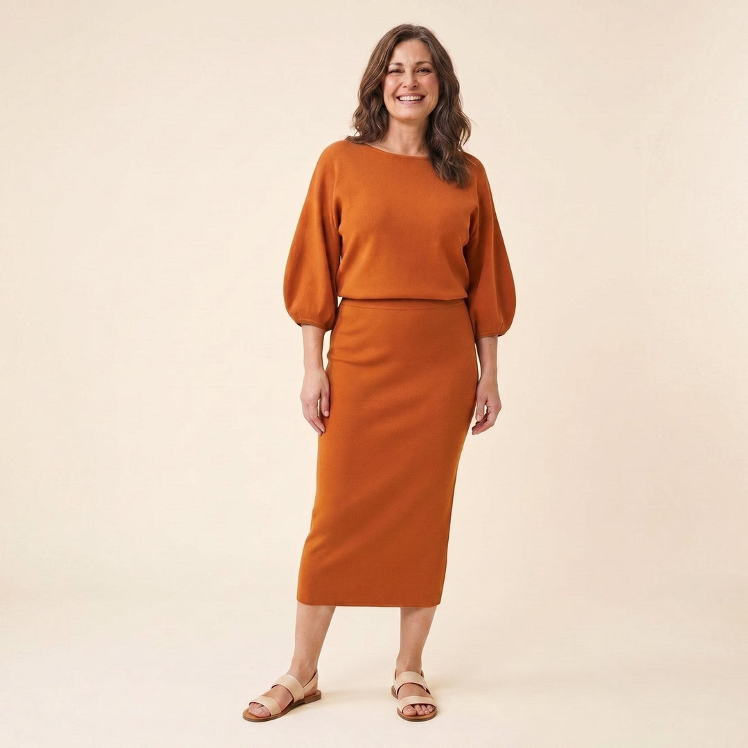 Mira burnt orange puff sleeve top and midi skirt set front on model