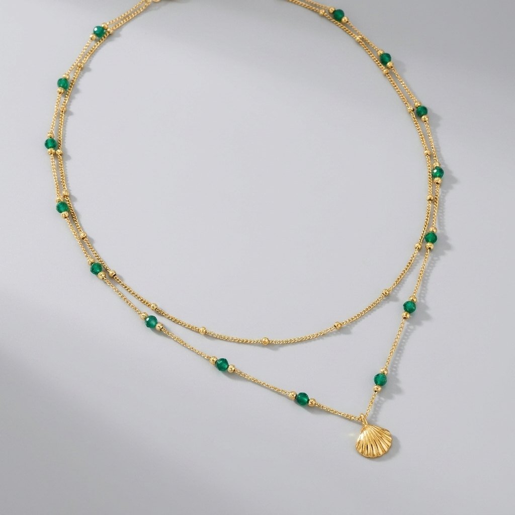 Niyah gold beaded necklace shell pendant