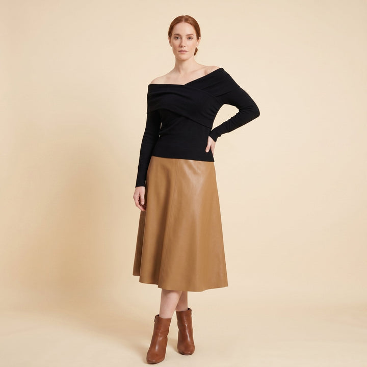 Olea off-shoulder knit top in black on female model
