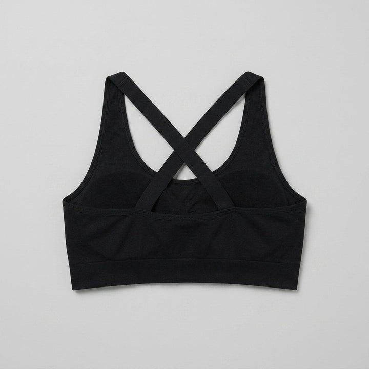 Ophelie sports bra in black, cross-back straps seen from behind