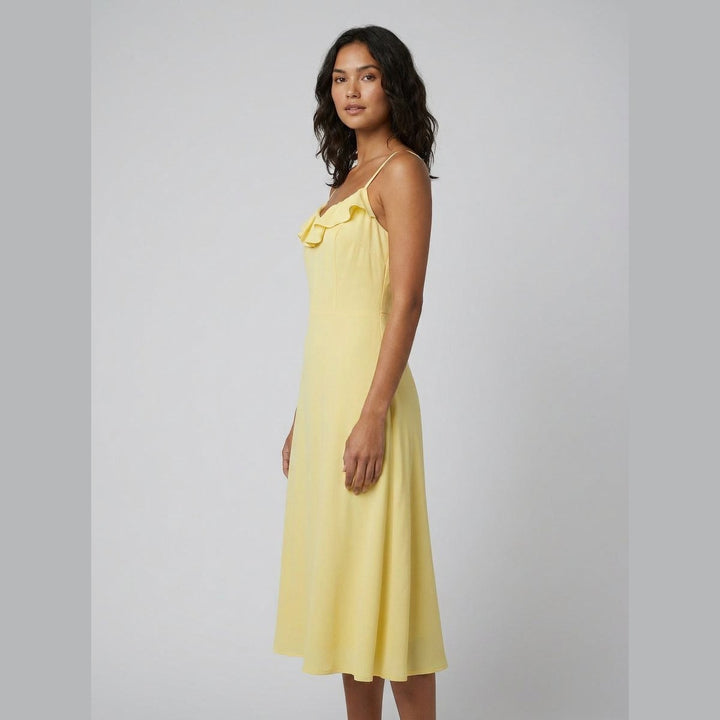 Raffi yellow midi dress three-quarter side view on model