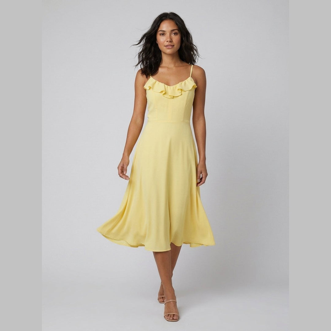 Raffi yellow midi dress walking pose on model