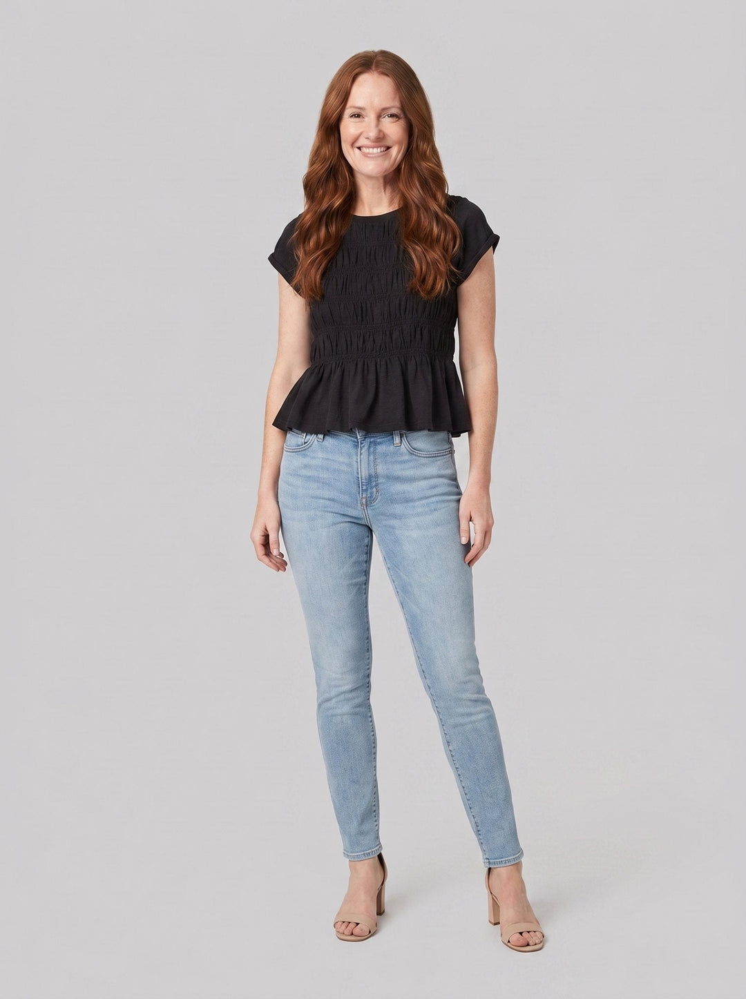 Rita ruffle top in black, front view