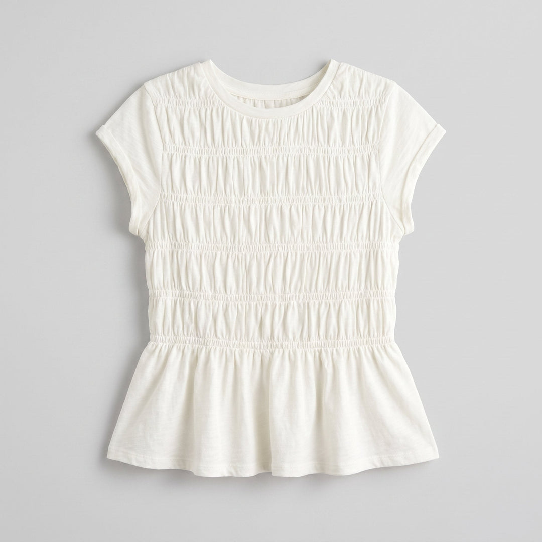 Rita ruffle top, folded flat-lay product photo