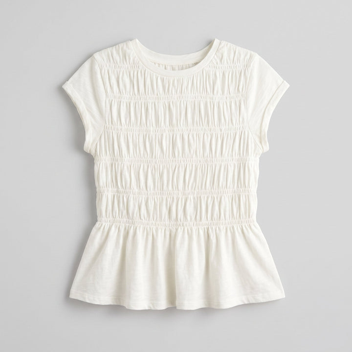 Rita ruffle top, folded flat-lay product photo