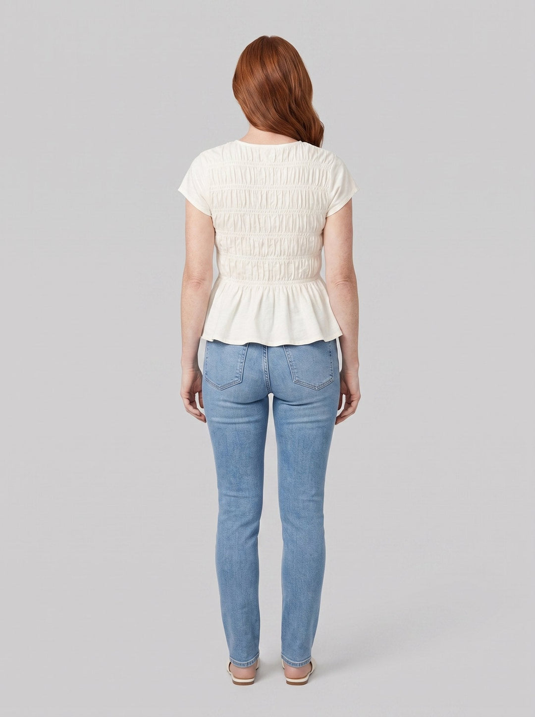 Rita ruffle top in white, back view