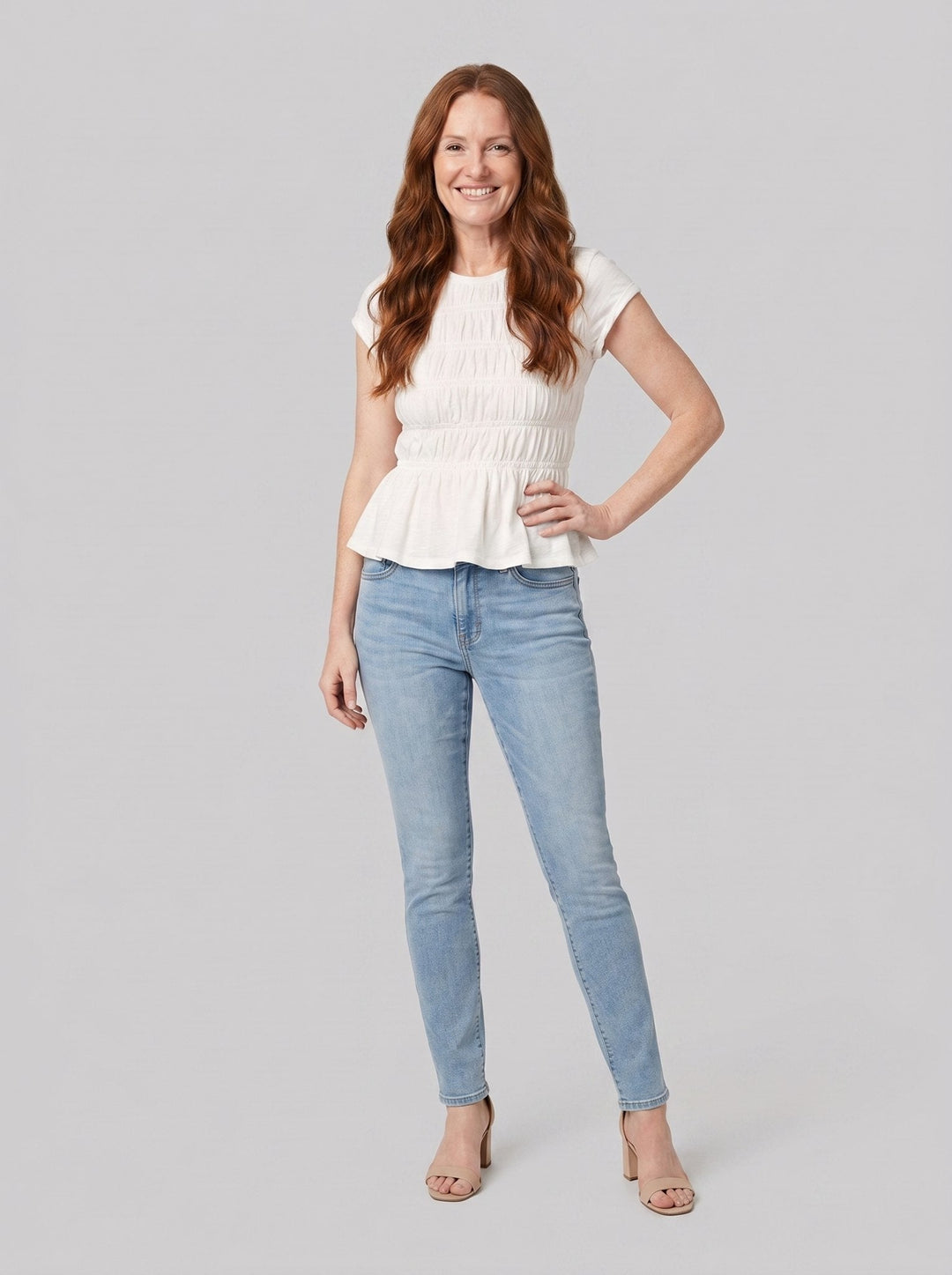 Rita ruffle top in white, front view relaxed pose