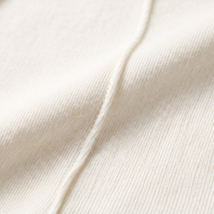 Fine ribbed knit fabric and raglan seam close-up detail