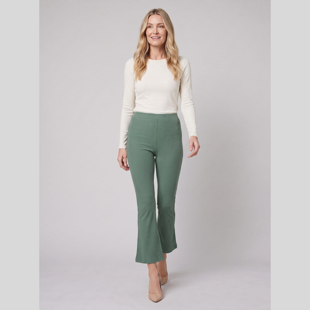 Roselyne high-rise flare pants in sage green, walking pose
