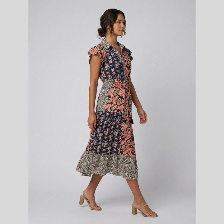 Sabrine cotton midi dress in a mixed floral print, side view on model
