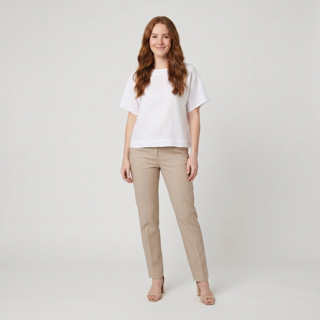White loose-fit linen top with round neck, front view on model