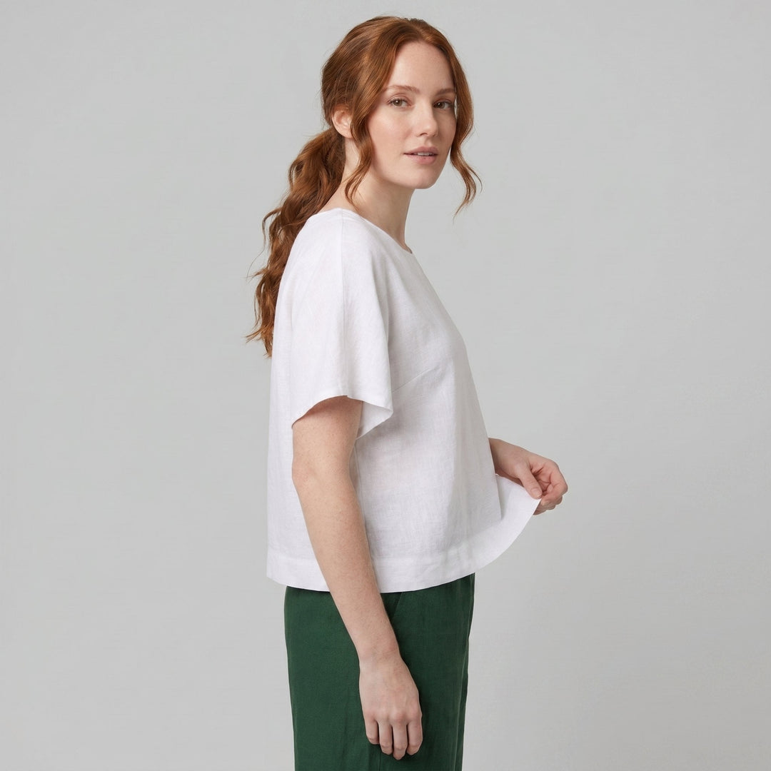 White linen top with short sleeves, side view on model