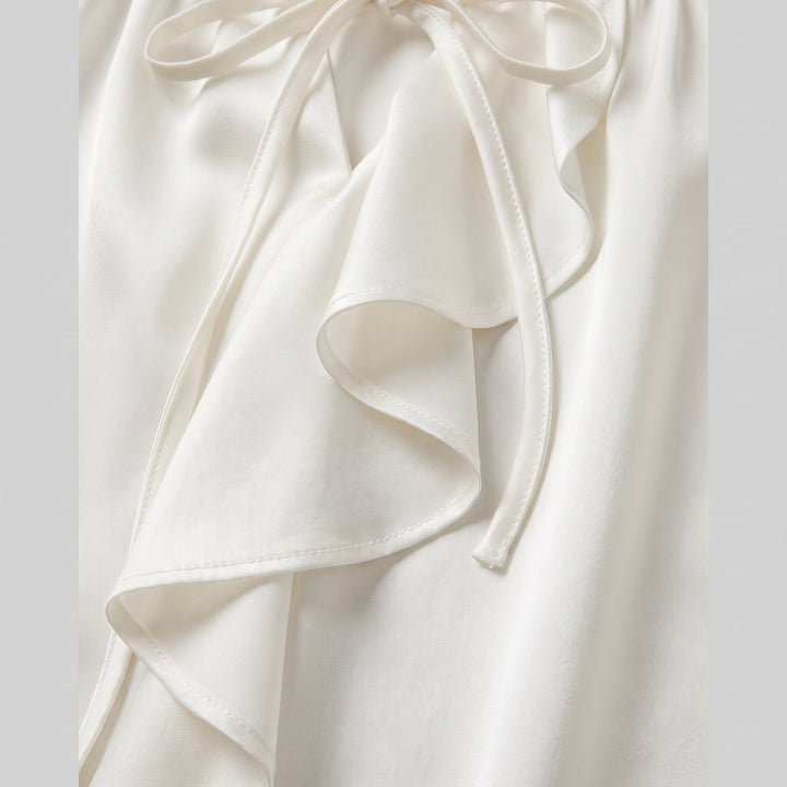 Severine blouse satin fabric and flounced ruffle trim close-up