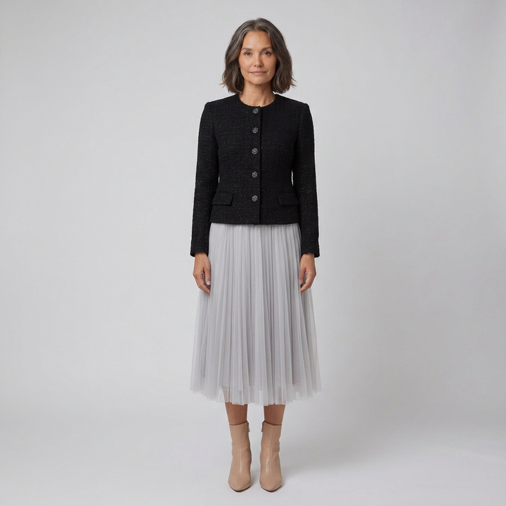 Black and grey tweed jacket with pleated tulle midi skirt, front view on model