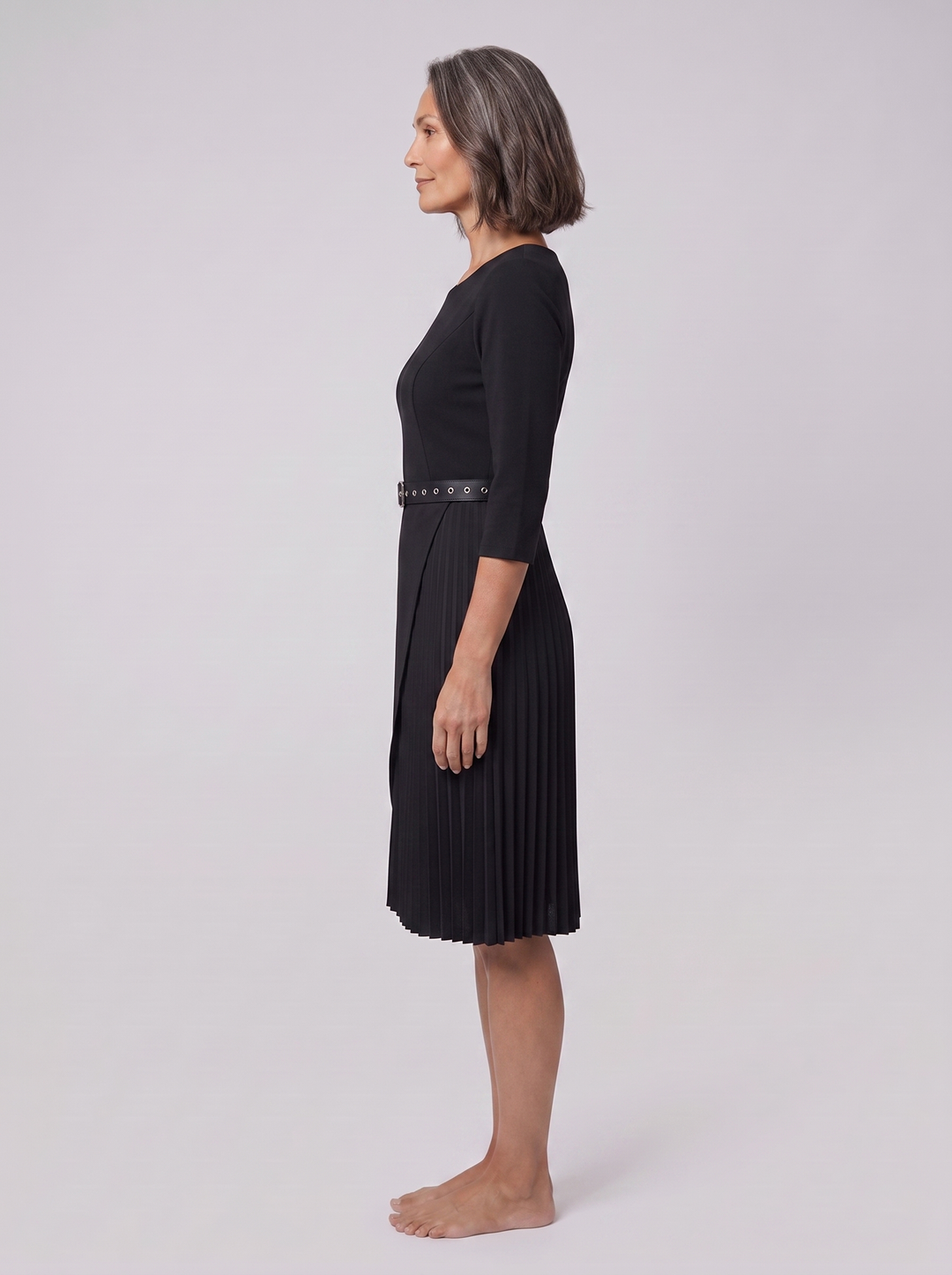 Black belted midi dress, side view on model