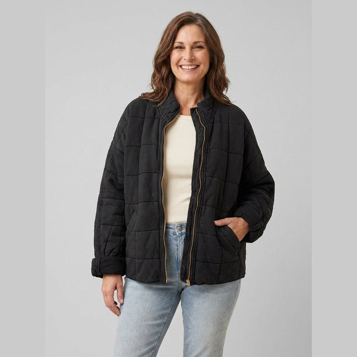Timber oversized quilted jacket in black on model