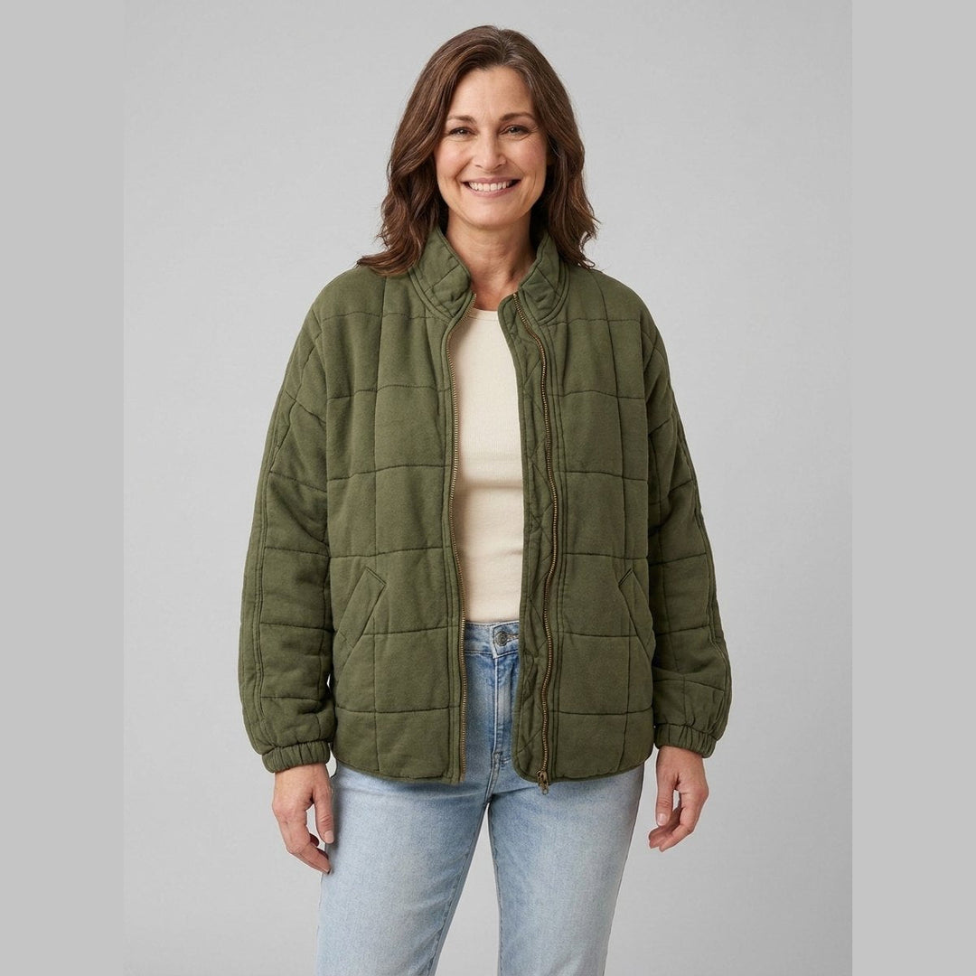 Timber oversized quilted jacket in khaki olive green on model