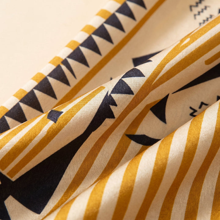 Close-up of the geometric print on the satin fabric