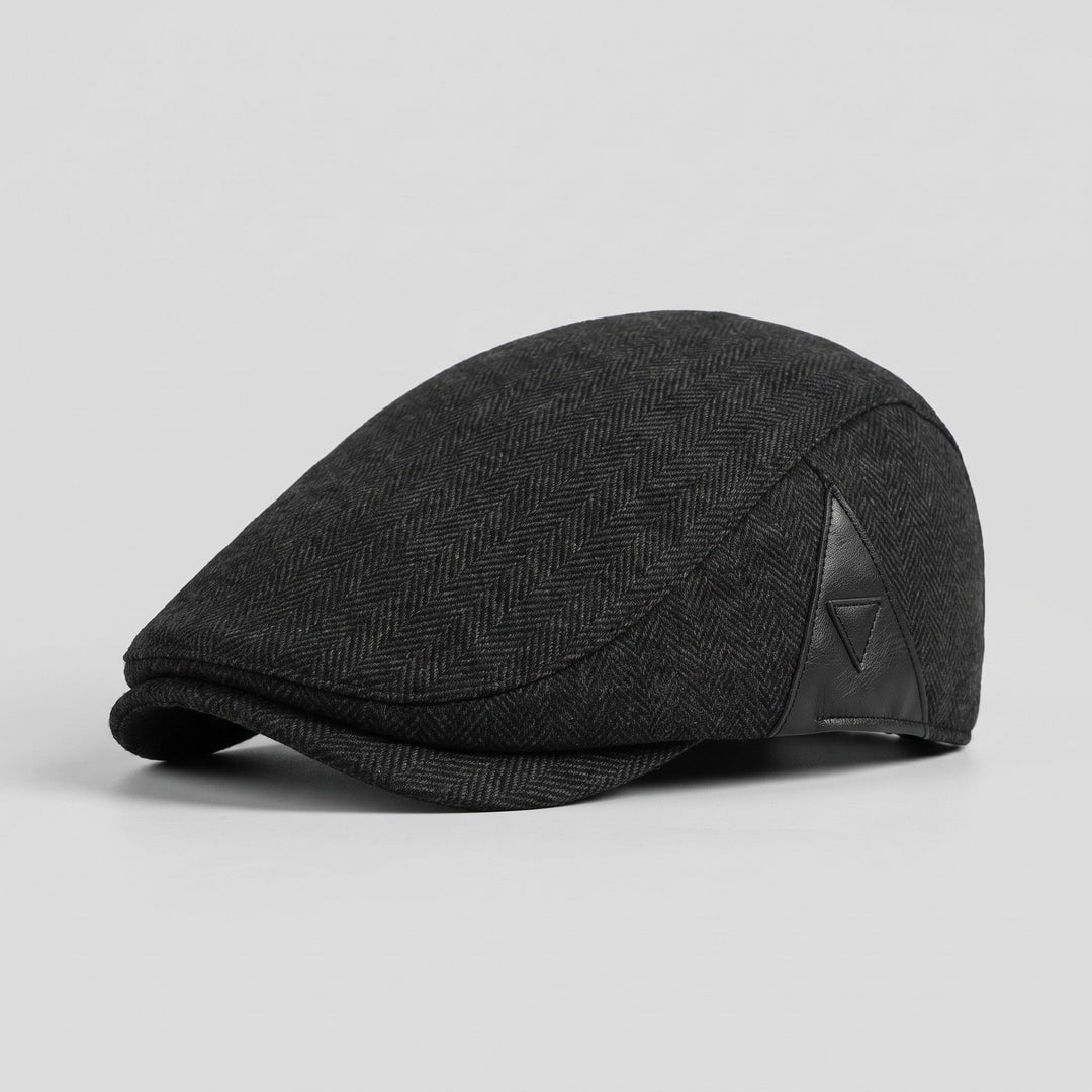 Black herringbone wool flat cap, three-quarter view