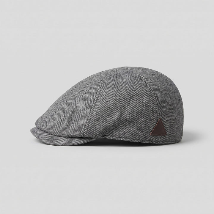 Grey herringbone wool flat cap, side profile