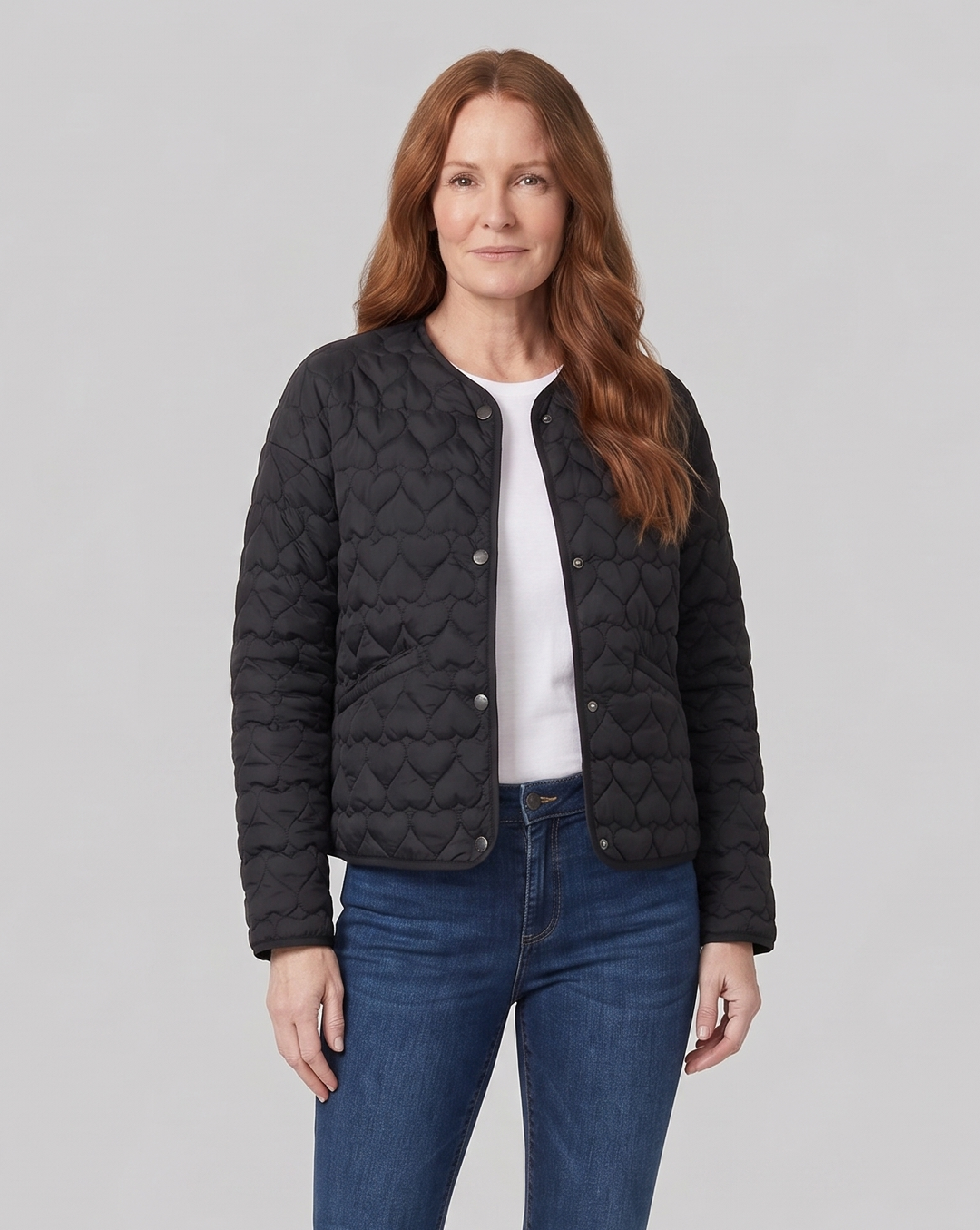 Women's black quilted jacket, close-up