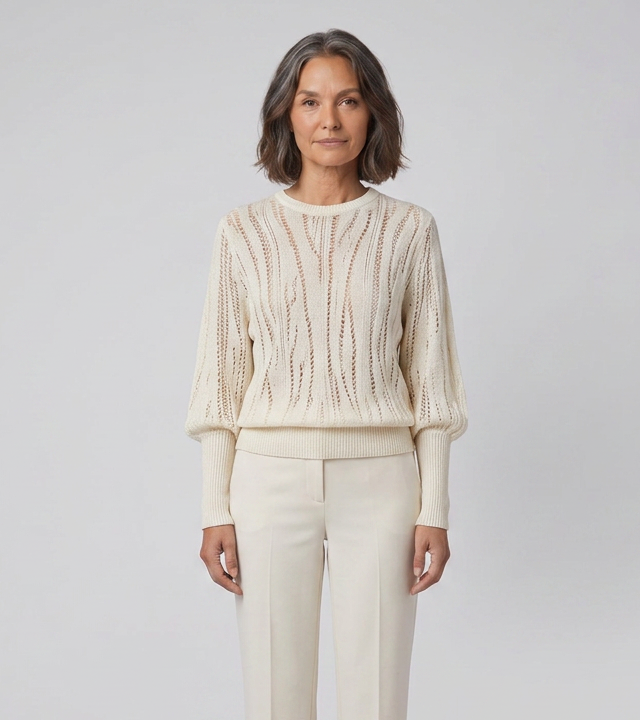 Women's ribbed knit sweater in cream, close-up