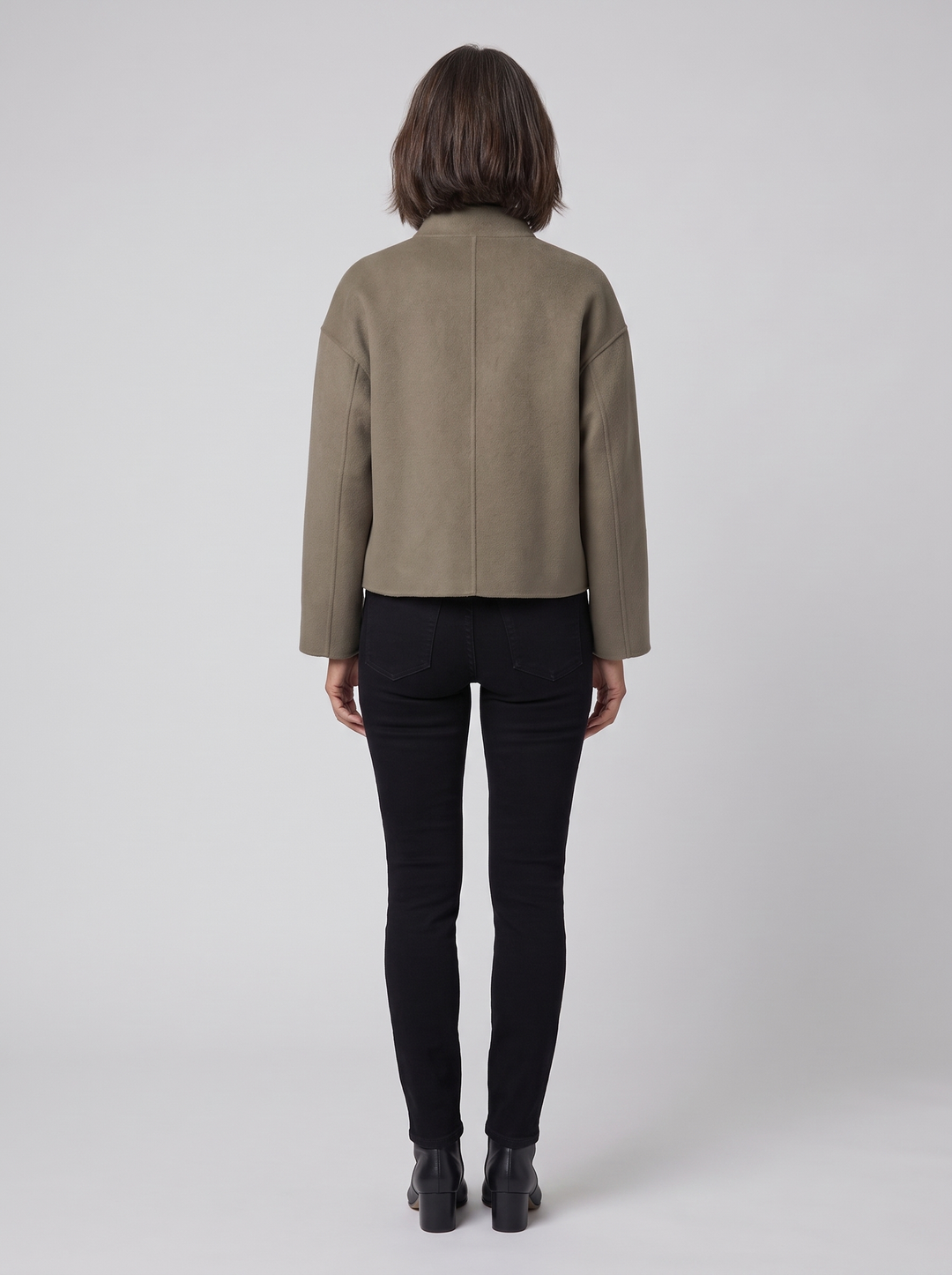 Women's olive short jacket, back view